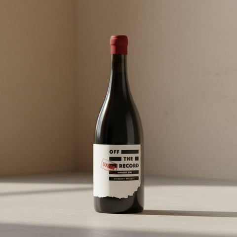 Wine bottle with a label reading 'Off the Record' on a white background